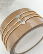 Bracciale Tennis Scintille con simbolo bicolore zirconato